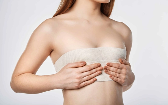 Breast Implants & Reduction Treatment Near Gandhipuram A cosmetic surgeon performs expert breast reduction surgery for improved chest contour.