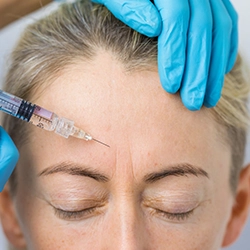 Get Botox treatment near Gandhipuram to reduce facial lines, forehead wrinkles, and under-eye creases